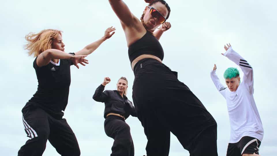 Four Gen Z dancing outside.